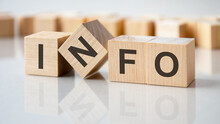 Four Wooden Blocks With The Letters Info On The Bright Surface Of A Gray Table, Business Concept
