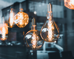 Wall Mural - Closeup of the lightbulbs with windows reflecting a street.