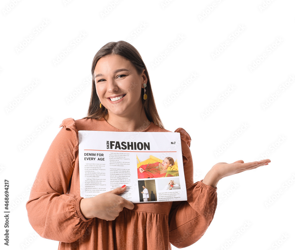 Smiling young woman with newspaper showing something on white background