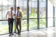 © Blue Jean Images - Confident business people talking