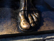 Toe of ancient giant bronze statue of medieval Gregory of Nin outside wall of Diocletian's Palace in Split, Croatia.