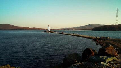 Wall Mural - Seascape with a view of the white lighthouse. Vladivostok, Russia