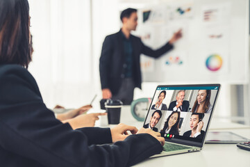 Business people in video call meeting proficiently discuss business plan in office and virual workplace . Telework conference call using smart video technology to communicate colleague .