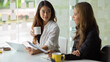 © bongkarn - Businesswoman is listening to one of her coworkers explain project.