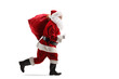 Full length profile shot of santa claus running with a sack on his shoulder