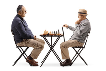 Poster - Two male pensioners playing chess at a table