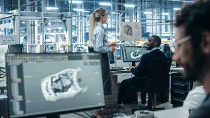 Leinwandbilder - Car Factory Office: Engineer Working on Turbine Prototype on Computer, Design Advanced 3D Model for High-Tech Green Energy Electric Engine. Diverse Team Work in Automated Manufacturing Facility