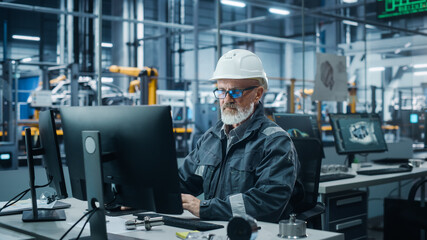 Leinwandbilder - Car Factory Office: Portrait of Male Engineer Wearing Safety Hard Hat Working on Computer. Techniciancian Constructing Component. Automated Robot Arm Assembly Line Manufacturing Electric Vehicles