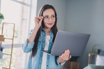 Poster - Photo of happy dreamy positive mature woman look imagine laptop work good mood indoors inside house home