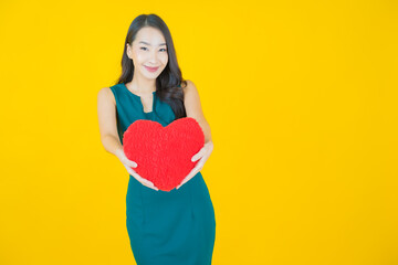 Poster - Portrait beautiful young asian woman smile with heart pillow shape