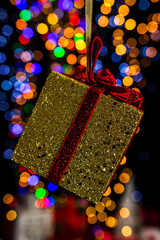 Poster - Hanging Christmas decoration against bokeh lights background