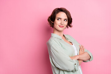 Wall Mural - Profile side view portrait of attractive curious girl folded arms thinking copy space advert isolated over pastel pink color background