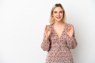 Young caucasian woman isolated on white background showing ok sign with two hands