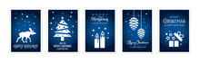 Set Of Christmas And Happy New Year Greeting Cards Blue Coloured Background. Four Vector Illustrations Postcards With Lettering Calligraphy Decorative Ornament Elements