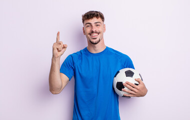 young handsome man feeling like a happy and excited genius after realizing an idea. soccer concept