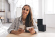 © BullRun - Girl looking on business card and smartphone