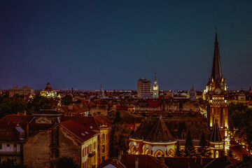 view of the city Arad at night, buildings and chapel