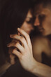 © Antonina Trushina - close-up, a couple in love kissing and hugging, stroking each other's hands, touching hands close-up