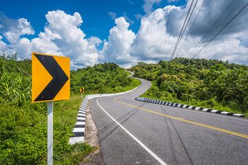 Sticker - country road rolls over hills on a sunny day