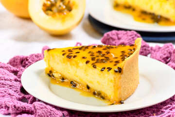 Wall Mural - SLICE OF PASSION FRUIT PIE ON A WHITE PLATE, PHOTOGRAPHED IN CLOSE-UP WITH SELECTIVE FOCUS