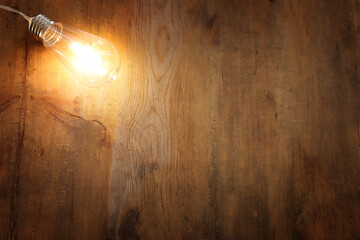 Education and innovation concept . Creative idea. light bulb over wooden table