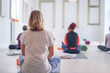 © lorenzophotoprojects - Back photos of a yoga class, with people of different ages.