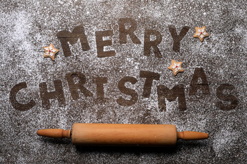 Wall Mural - Merry Christmas With Cookie Letters on Wooden Background