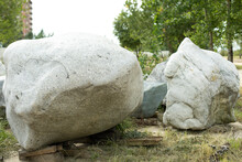 Two Large Gray Boulders Close-up In The City Park. The Texture Of The Stone, The Decorative Design Of Parks In Russia. Outdoor Shooting.