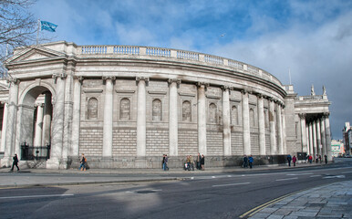 DUBLIN - MAR 12: Tourists walk in city streets, March 12, 2010 in Dublin. More than 3.5 million people visit the city every year