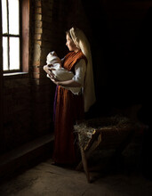 Mary In The Stable Near The Manger With The Baby