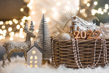 Happy New Year. Beautiful Background With Christmas Tree Toys In A Wicker Basket And The Numbers 2022. Christmas Holidays.The Concept Of The Beginning Of The Year And The Interior Design Of The House.