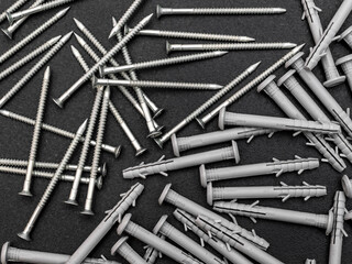 Sticker - Screws with dowels as abstract industrial background. Top view.