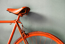 Detail Of A Red Retro Bike. Seat And Rear Wheel With Brake Pads Painted Red. Exhibition Of Obsolete Vehicles. Close-up