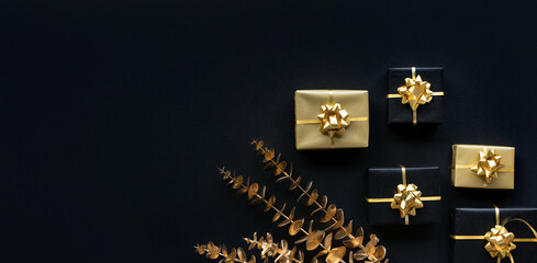 Wall Mural - celebration concepts with gold gift box decoration with mock up on dark background