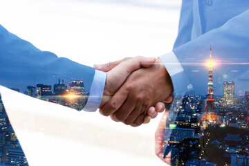 multi exposure investor business man shaking hand with partner for successful meeting with night city background, digital technology, investment, negotiation, handshake, partnership, teamwork concept