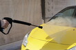 Car washing in a touchless car wash, spraying, car wash, cleanliness, dirt, maintenance