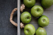 Flat lay composition of fresh ripe green apples on wooden table, space for text