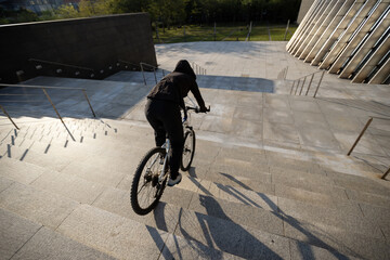 Wall Mural - Woman freerider riding down city stairs