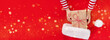 banner gift box in children's hands on a red background, presenting a gift	
