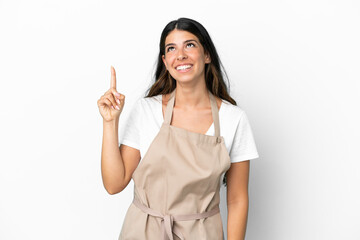 Wall Mural - Restaurant waiter over isolated white background pointing up and surprised