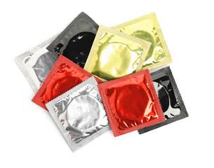 Condom packages on white background, top view. Safe sex