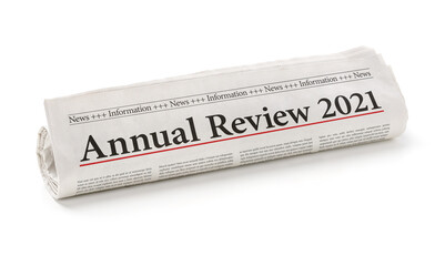 Rolled newspaper with the headline Annual review 2021