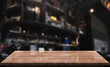 © DEEP PIXEL - Empty wooden table top with lights bokeh on blur restaurant background.