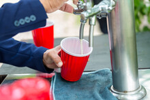 Beer In Red Cup. Red Plastic Drinking Cups. Plastic Red Solo Drinking Cups For Beer Pong Or Drinking Game. 