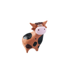 Clay cow figurine on white background, isolated object. A toy.