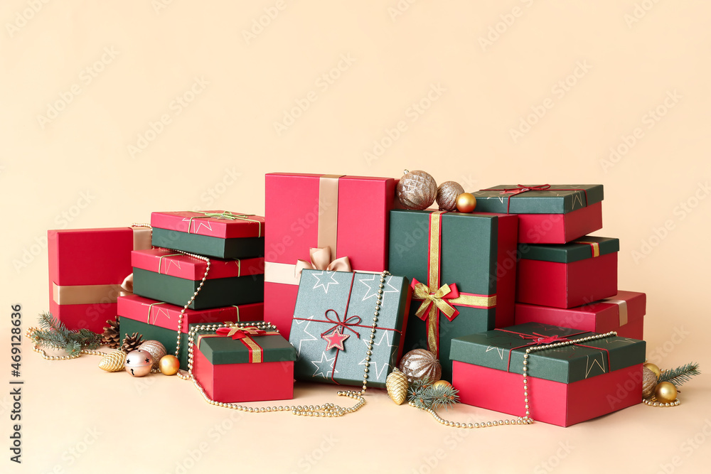 Christmas gift boxes and decor on beige background