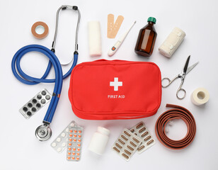 flat lay composition with first aid kit on white background