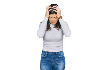 Wall Mural - Beautiful brunette woman wearing casual clothes suffering from headache desperate and stressed because pain and migraine. hands on head.