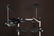 © New Africa - Modern electronic drum kit with sticks on brown background. Music instrument