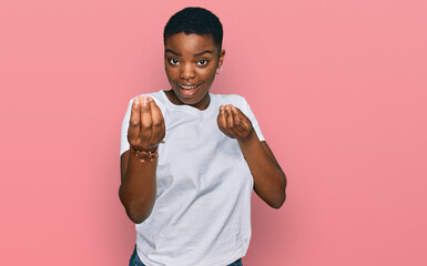 Sticker - Young african american woman wearing casual white t shirt doing money gesture with hands, asking for salary payment, millionaire business